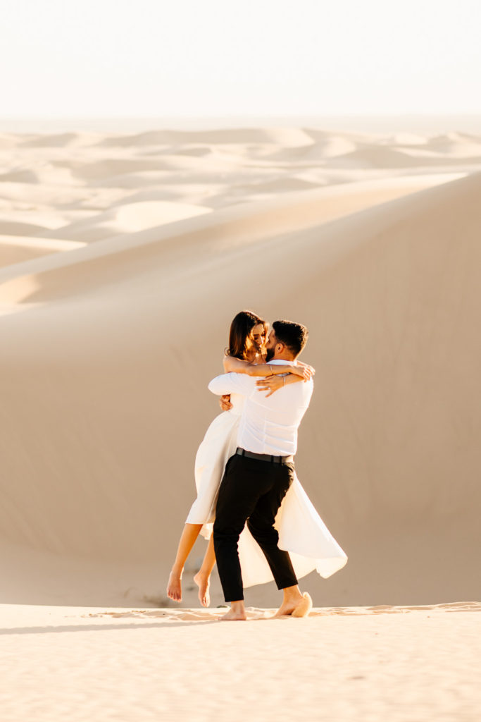 Sand dunes engagement couple