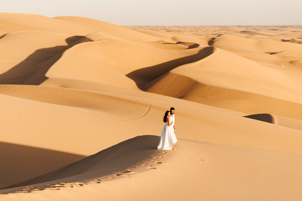desert sand dunes engagement couple