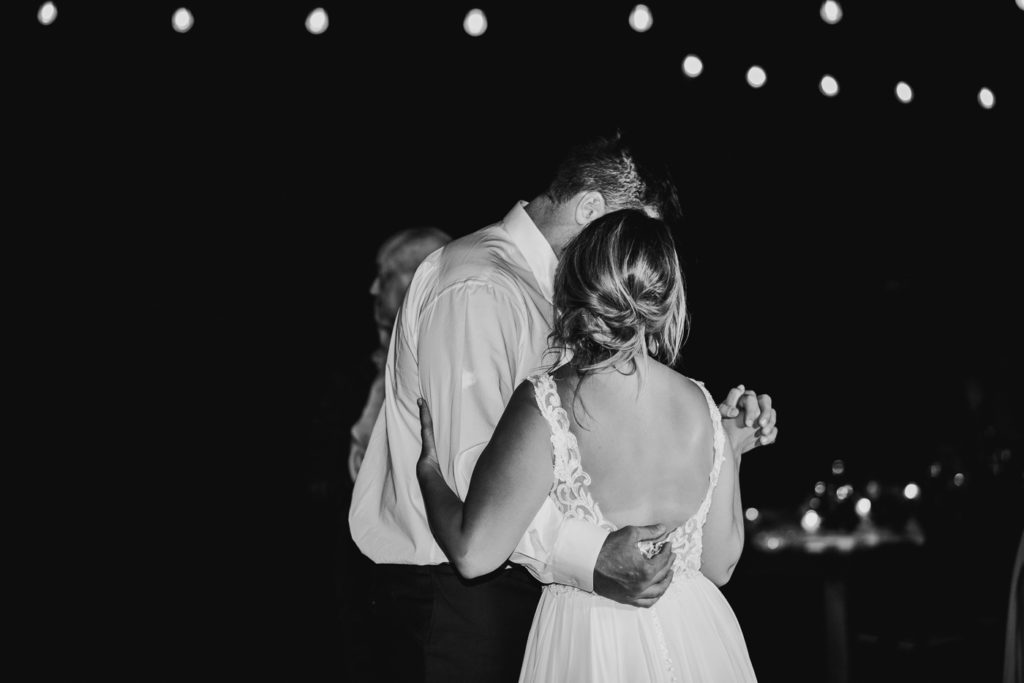 black and white photo of wedding couple at reception