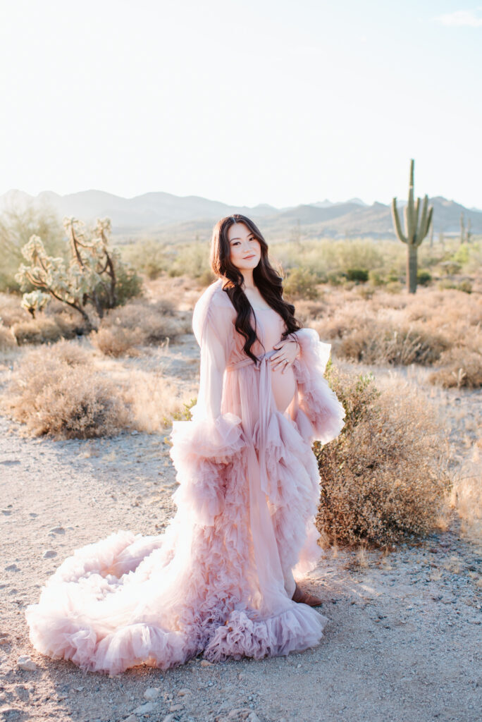 A flowy dress with ruffles is an amazing choice for what to wear for maternity photos, adding drama to the shoot!