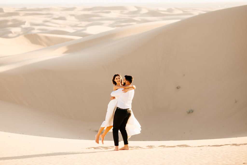 Sand dunes engagement couple